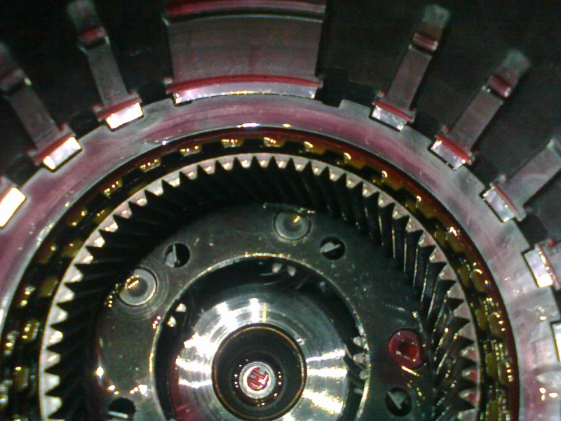 Now we add another stack. These alternating steels and frictions make up the 2-4 clutch pack.